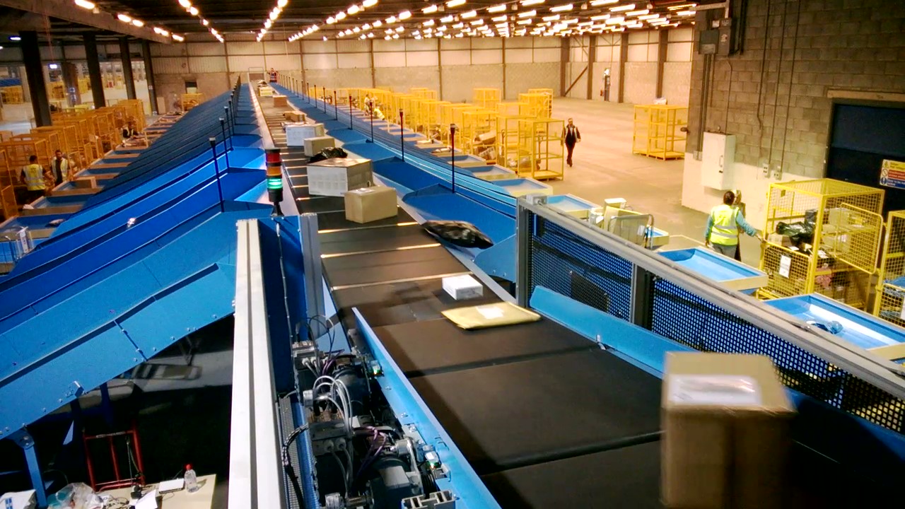 Interroll Vertical Cross Belt Sorter by IDC